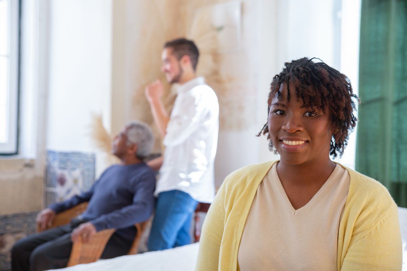 A caregiver checking in on an older adult recovering at home
